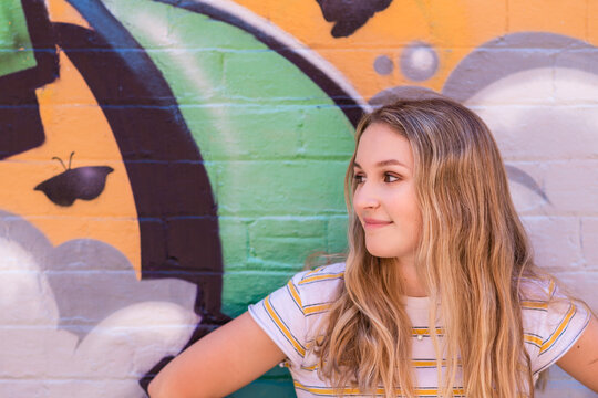 Teen Leaning Against Wall