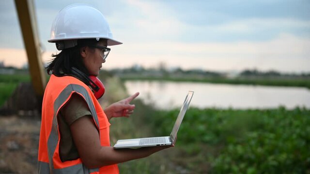 Environmental engineers work at the water storage plant, check the pH of the water, check the quality of the water
