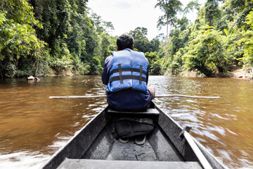 Taman negara river cruise along Tembeling river with lush rainforest foliage at Taman Negara National Park, Pahang