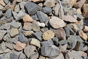 various colored stones lying flat on the ground