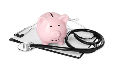 Piggy bank, stethoscope and clipboard on white background