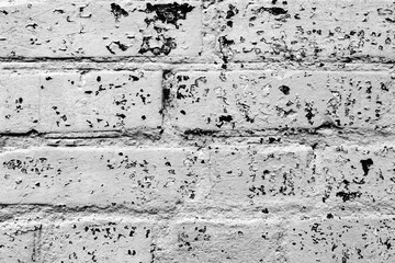 Obraz premium Texture of a brick wall with cracks and scratches which can be used as a background