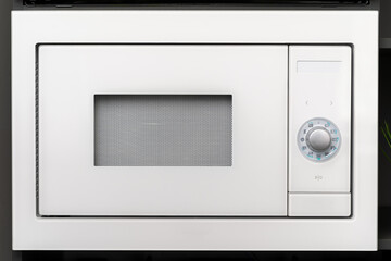 New modern microwave oven in a shop, close up