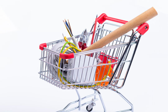 The photo shows a shopping cart, which contains installation materials and tools