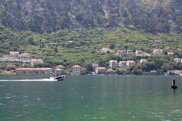 Landscape with blue sea and green mountains. Panoramic beautiful view over the sunny city. Balkans on a wonderful summer day.