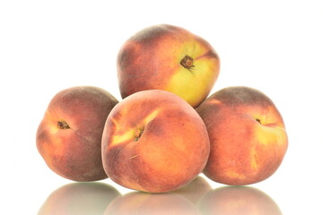 Fototapeta na wymiar Several ripe organic peaches, close-up, isolated on white.