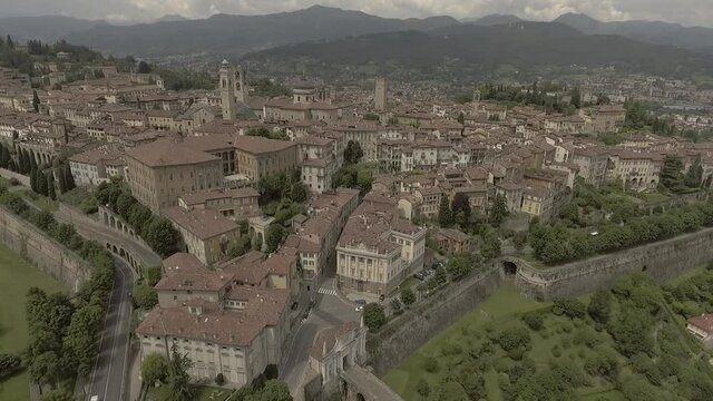 Aerial drone footage view of Bergamo, historical buildings and towers  of Old city, in Italy  no video editing
