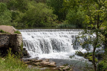 Monsal Dale Weir waterfall in Derbyshire, UK