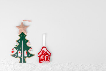 Christmas composition. Gifts, fir tree branches, red decorations on white background