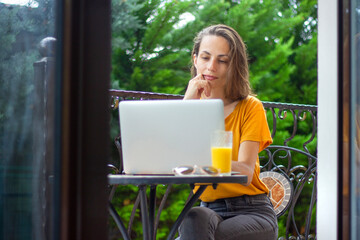 pretty girl and laptop close up. Online education or blogging