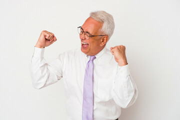 Senior american man isolated on white background raising fist after a victory, winner concept.