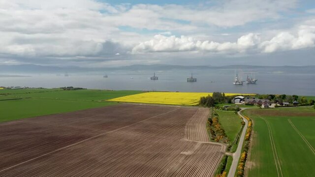 4k drone footage of oil rigs in Cromarty Firth in the Scottish Highlands, UK