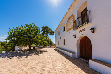 Naklejka premium Sueca, Spain. Hermitage of the Saints. White little building on top of a hill. Place of worship.