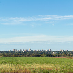 Landscape with city in the background.