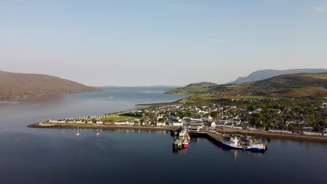 4k drone footage of the seafront at Ullapool in the Western Highlands of Scotland, UK
