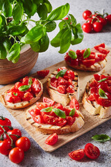 italian tomato and basil bruschetta on a wood board