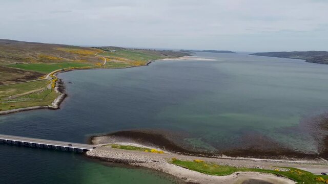 4k drone footage of the Kyle of Tongue bridge in the Scottish Highlands, UK