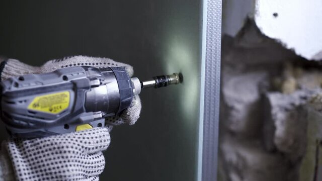 Screwing The Plasterboard To The Metal Profile