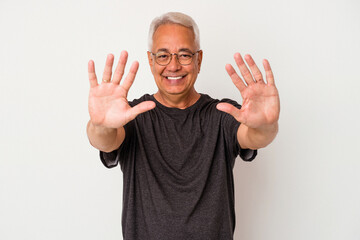 Senior american man isolated on white background showing number ten with hands.