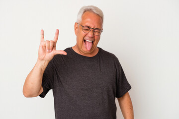 Senior american man isolated on white background showing rock gesture with fingers
