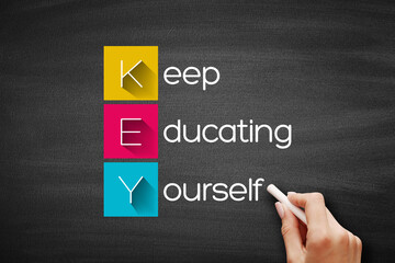 KEY - Keep Educating Yourself acronym, education concept background on blackboard