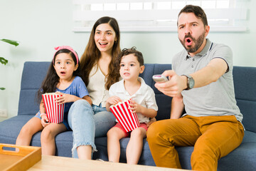 Excited family watching a movie together
