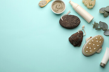 Flat lay composition with pumice stones on turquoise background. Space for text