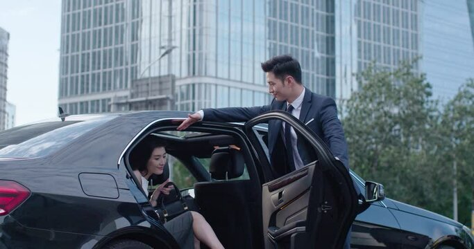 Confident businesswoman getting out of car,4K