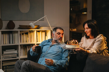 mature couple celebrating anniversary at home
