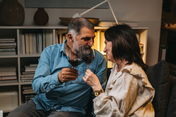 mature couple celebrating anniversary at home