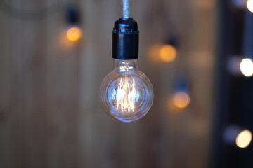Close up of luxury round light bulbs in a vintage living room. Vintage lightbulb on dark background.