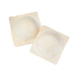 Uncooked ravioli with filling on white background, top view