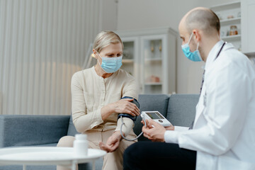 doctor checking his patient blood pressure. concept of healthcare.