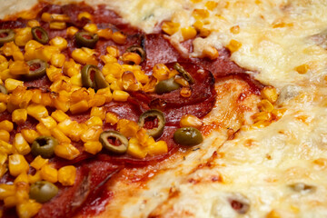 detail view of the surface of a decorated pizza