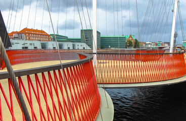 Circle bridge with red metal fence in Copenhague