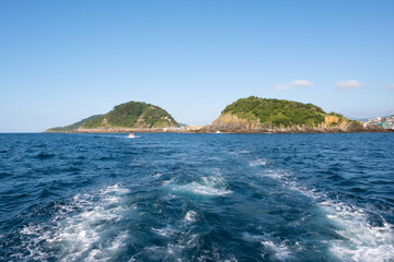 Santa Clara Island and Mount Urgull from the Cantabrian Sea in the city of Donostia-San Sebastian, Basque Country.