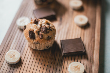 Fototapeta na wymiar Delicious banana and chocolate muffins