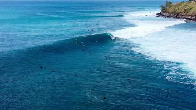 4K drone video tropical travel adventure surfing at a beautiful beach with huge waves