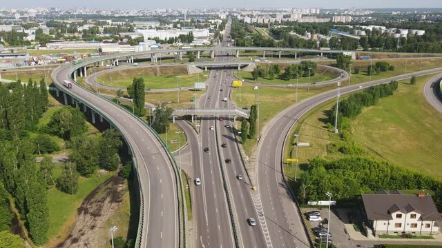 Aerial view of Highway transportation system highway interchange. Time lapse