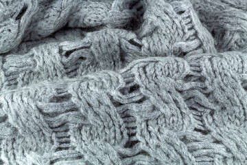 Winter warm cozy pulloverClose up background with texture of knitted clothes.