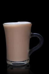 cup of coffee on a black background. cappuccino with milk froth