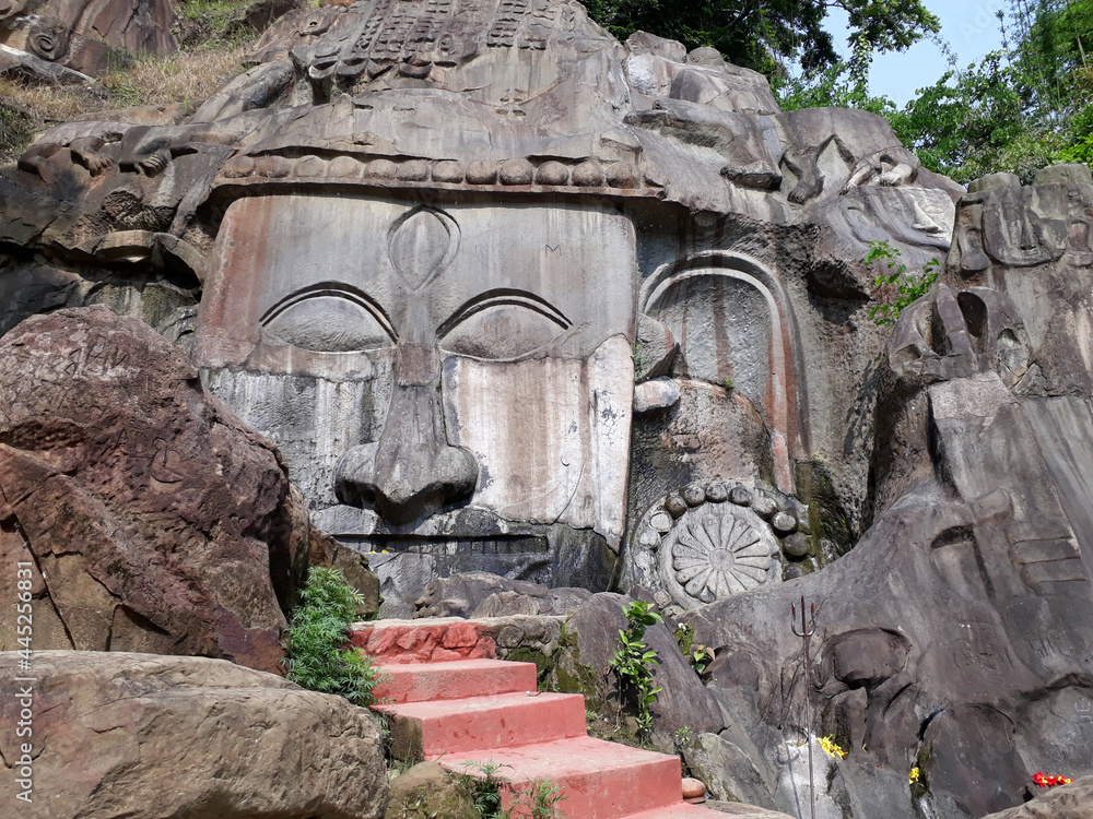 Poster Goddess in the hills of Unakoti carved on a rock in India