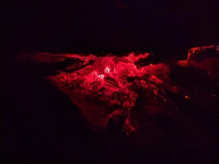 bonfire in the forest at night. campfire flame on black background.
