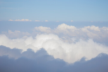 A mesmerizing view of the Iztaccihuatl volcano in the clouds