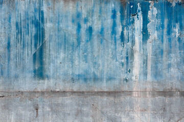Texture of flaking blue paint on the wall