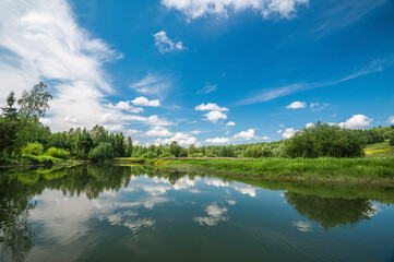 Obraz na płótnie Canvas Calm River. Clouds Reflection On Lake