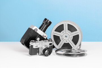 Naklejka premium Old vintage mechanical film camera with bobbin tape close up and film