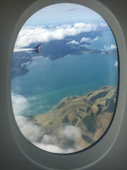 Looking out from an airplane window to the landscape of New Zealand's North Island