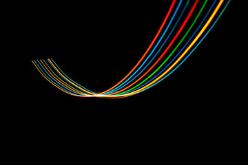 Luminous multicolored wavy lines rainbow on a black background