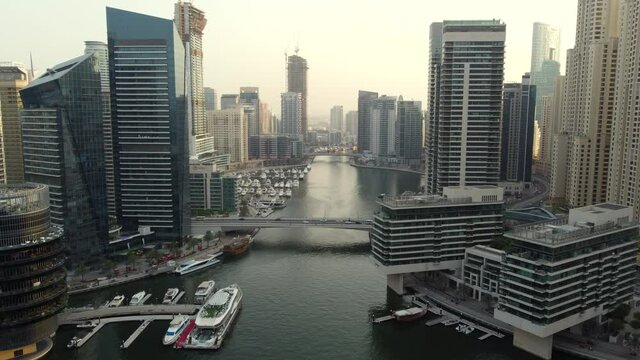 Stunning Aerial of Dubai Marina Skyscrapers during Sunset. Drone View.